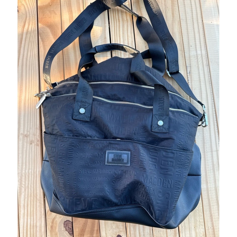 Black Steve Madden BGYM tote bag with a repeating logo pattern